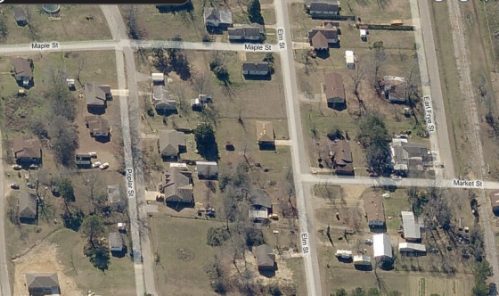 South facing view of homes along Elm Street and Poplar Street before the tornado. The section of Market Street that was later torn from the ground is visible at extreme lower right. Most of the residences in the area were old one and two-story homes, some of which were well anchored to their foundations. (Bing Maps)