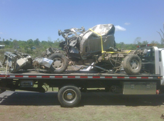 Image of the remains of Colt Robinson's truck as it was being towed away by the insurance company. (Image courtesy of Colt Robinson)