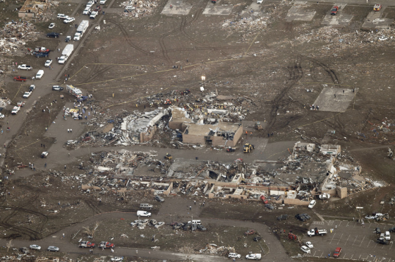 Probable EF5 damage to Plaza Towers Elementary School and homes to the south, which were swept from their foundations. Wind rowing and ground scouring were evident throughout the damage path in Moore.