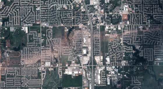 Satellite view of the tornado's devastating path through Moore. The tornado's most intense damage may have occurred just southwest of Briarwood Elementary School (far left).