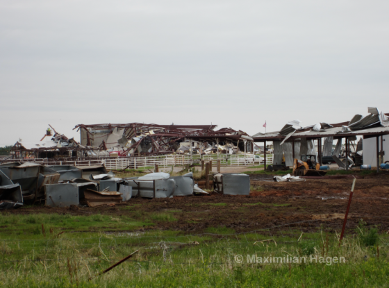 Closer view of the destroyed livestock complex. Dozens of large animals were killed throughout the tornado's path, leaving the smell of rotting flesh as the days passed. 