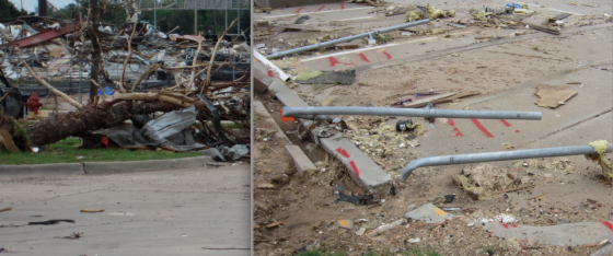Just west of the freeway, a large bowling alley was leveled to the ground. The steel cross-beams overlying the structure were broken and denuded. In the building's parking lot, parking signs were bent to the ground facing south. Some of the signs were bent in opposing directions at the base or snapped off entirely.